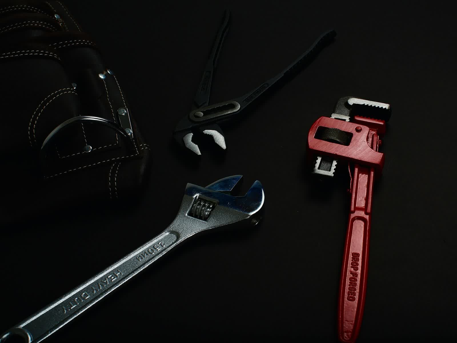 Premium repair tools arranged on a dark surface